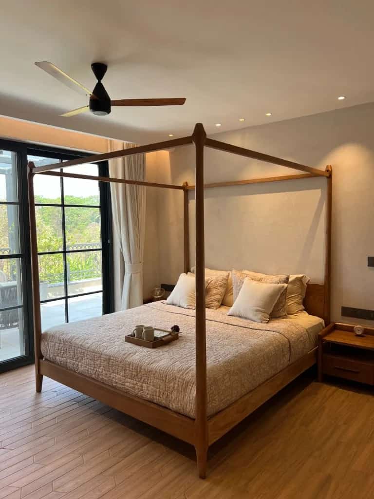 A bedroom opening to a private outdoor area in Pilerne.