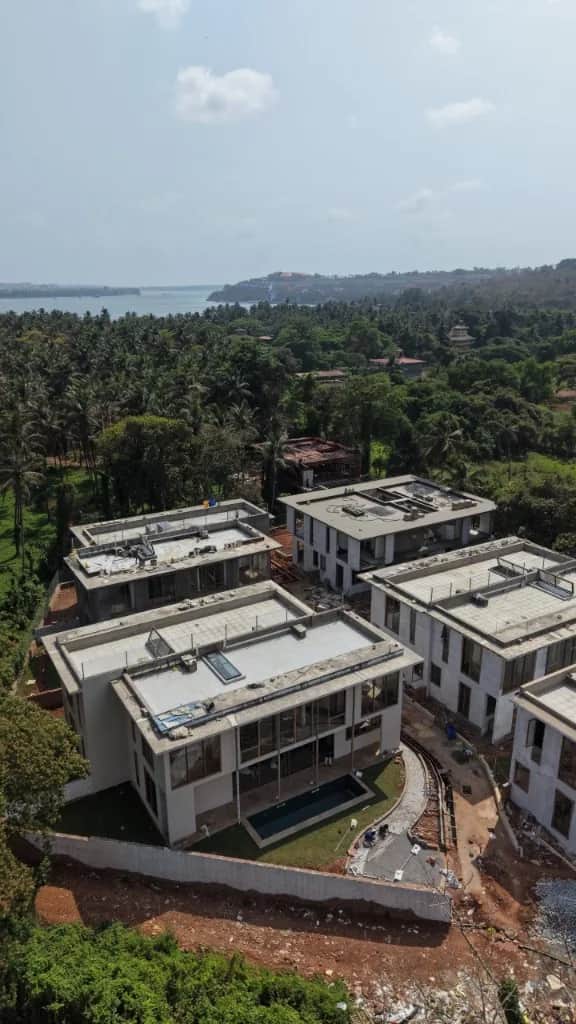 Villas taking shape among palms in Reis Magos, North Goa.
