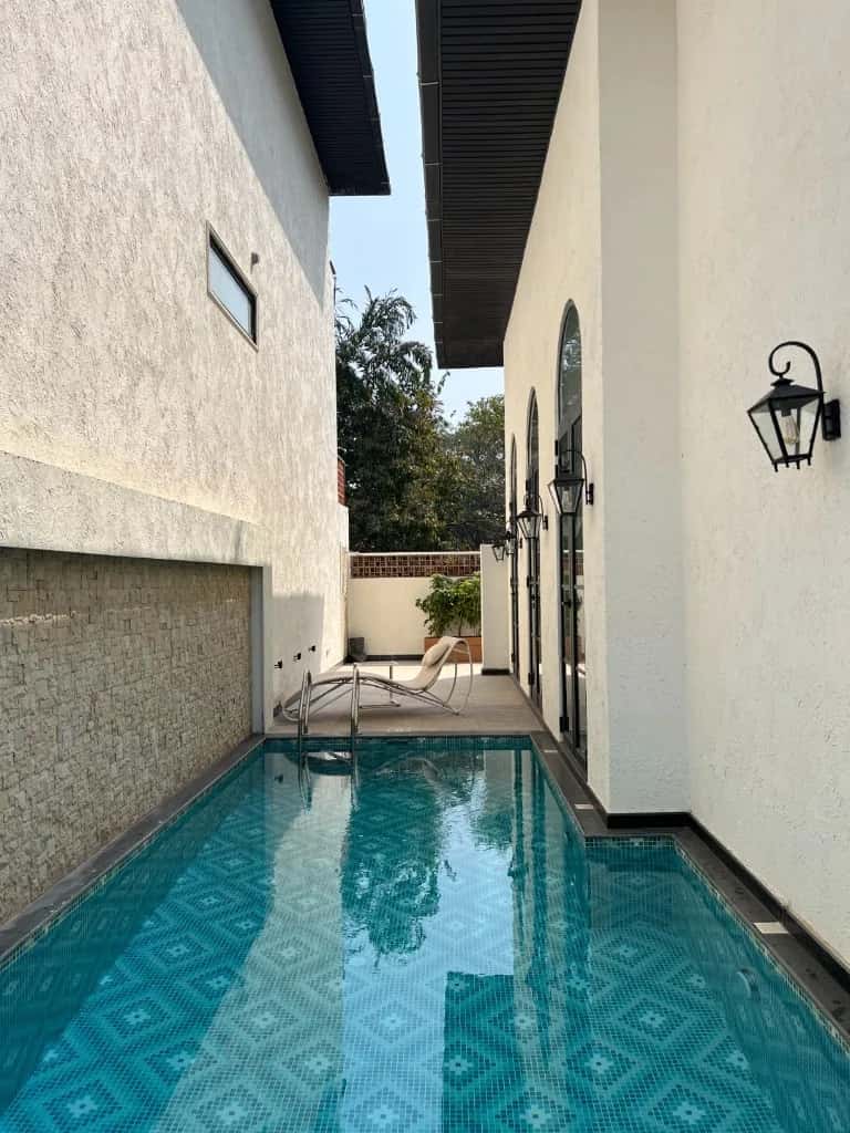 Lush villa gardens and private outdoor living in North Goa.