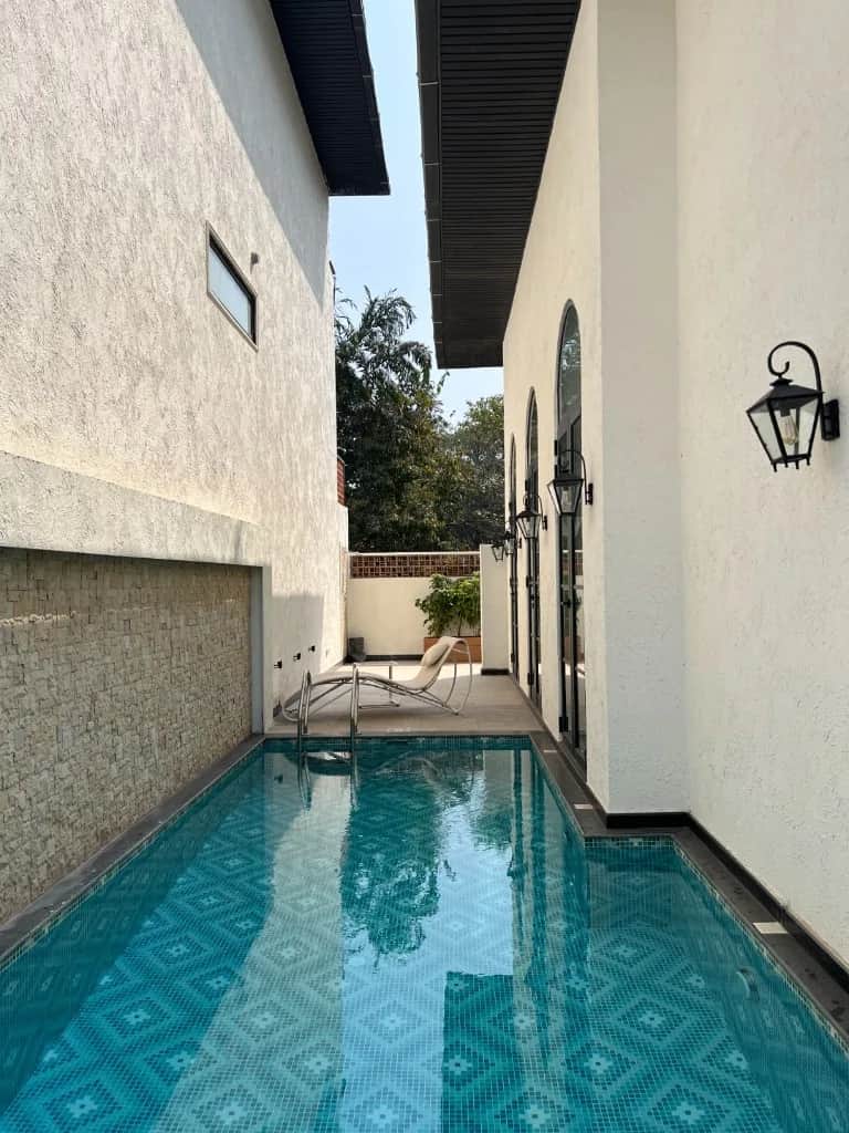 Private swimming pool and garden at the Pilerne villa collection.